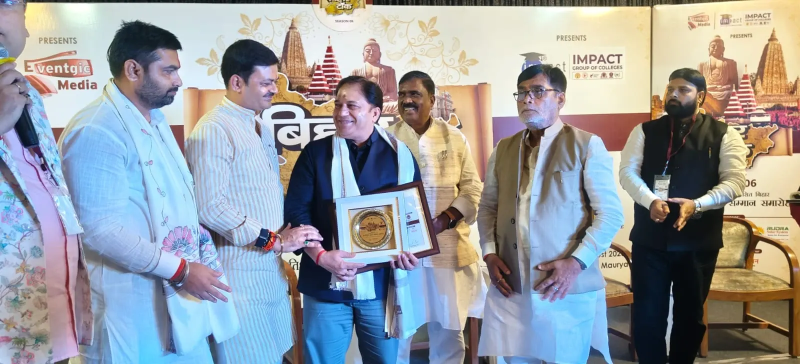 Dr. Kumar Rajesh Ranjan being felicitated with a memento at an honours ceremony in Patna