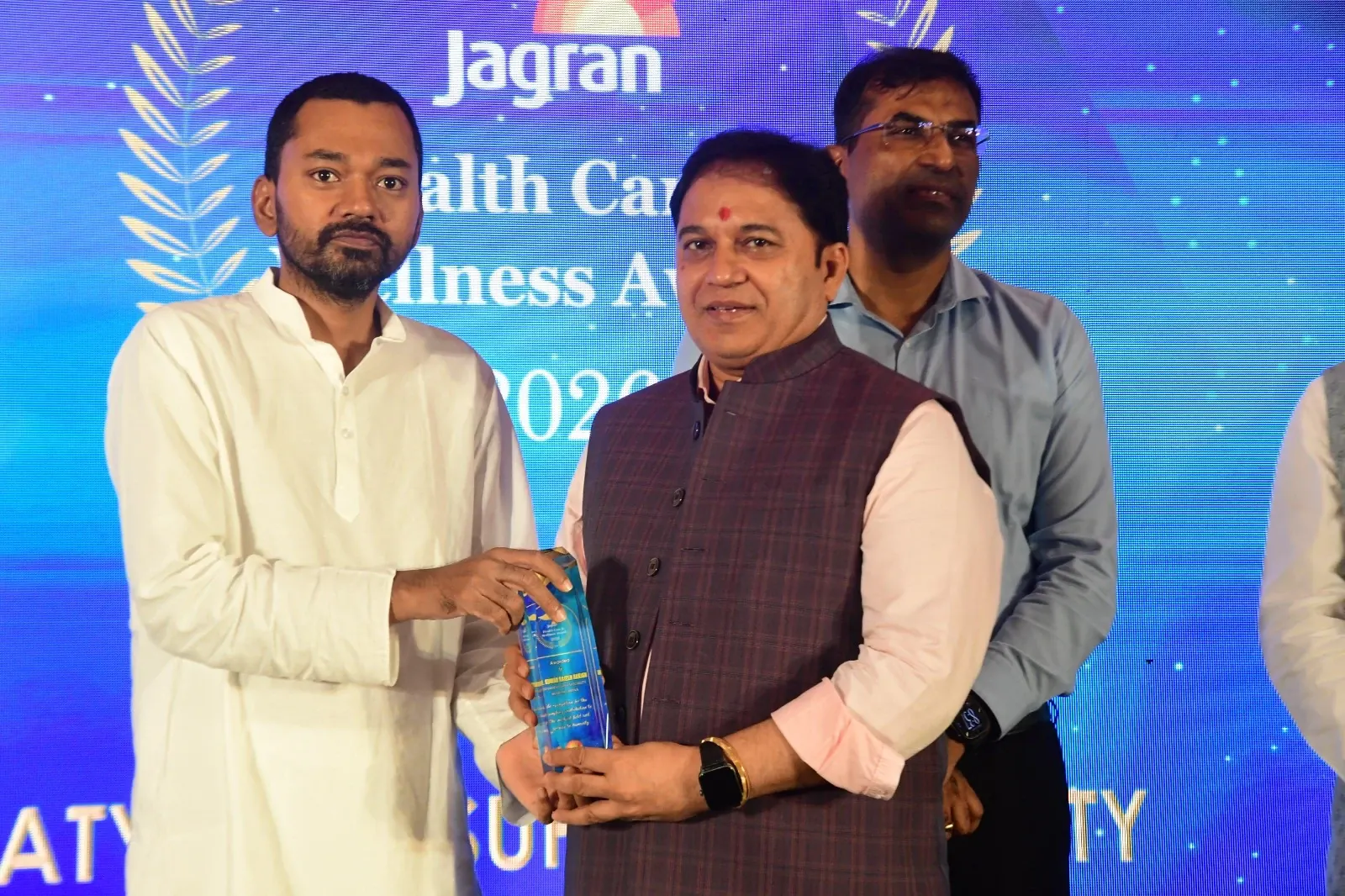 Dr. Kumar Rajesh Ranjan receiving the Jagran Health Care and Wellness Award